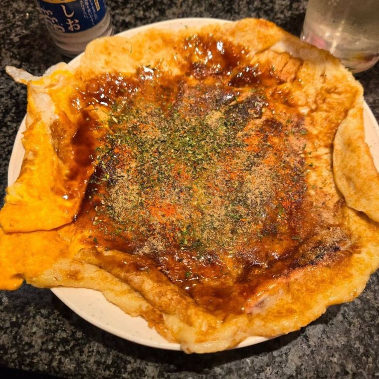 お皿いっぱいに盛られたタコハウスのイカ焼き