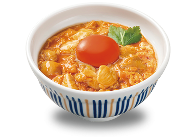 なか卯の親子丼の上に生卵が乗っている様子