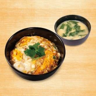 玉子丼と味噌汁が置かれている