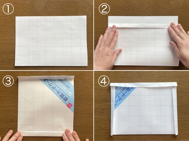 チラシを折ってゴミ箱を作っている写真