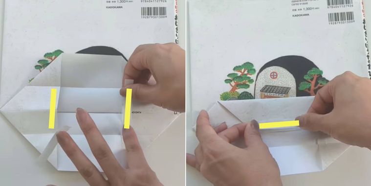 絵本カバーに両面テープを貼っている様子