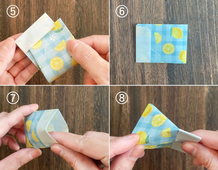 折り紙を折って紙袋を作っている写真