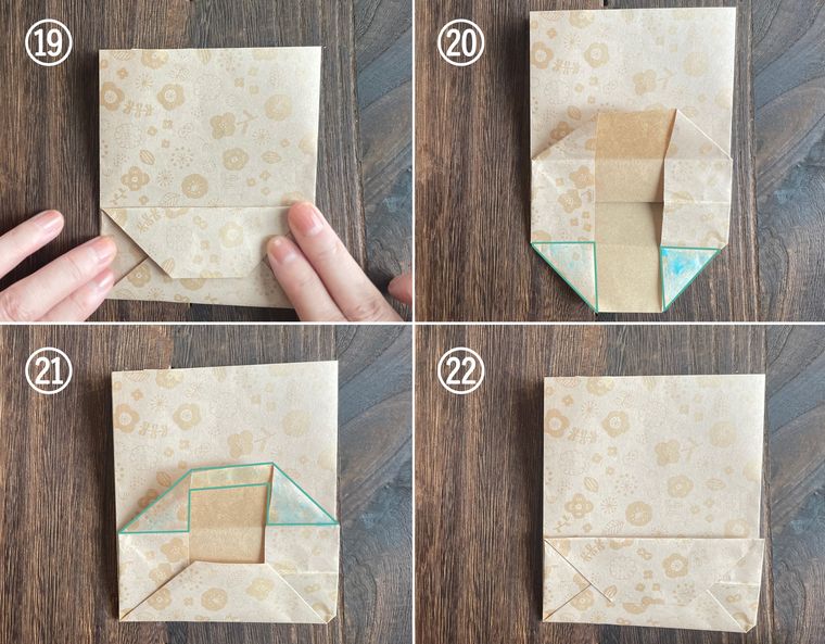 折り紙を折って紙袋を作っている写真