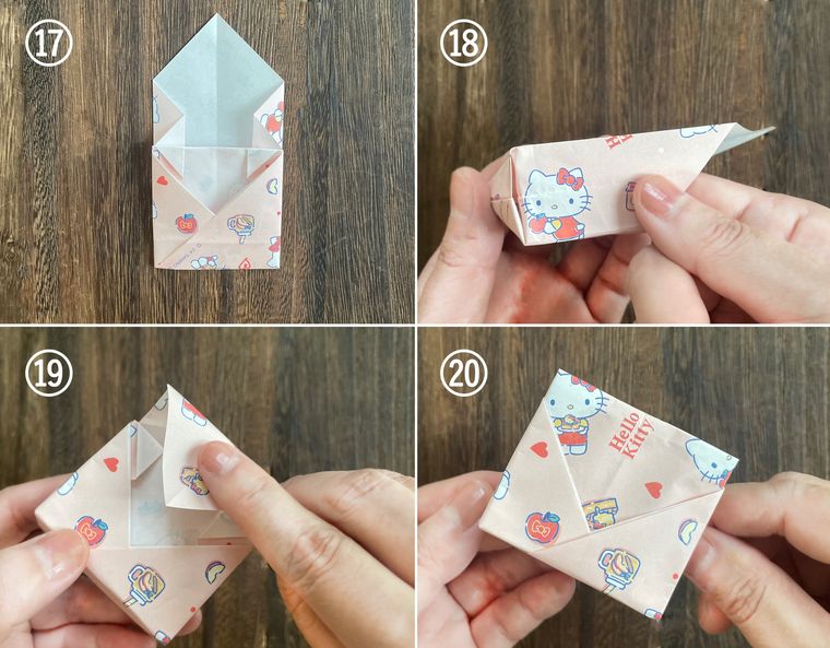 折り紙を折って紙袋を作っている写真