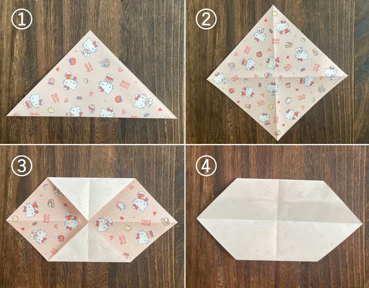 折り紙を折って紙袋を作っている写真