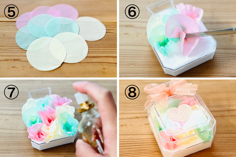 香水型のギフトボックスにフラワーペーパーを詰めている様子