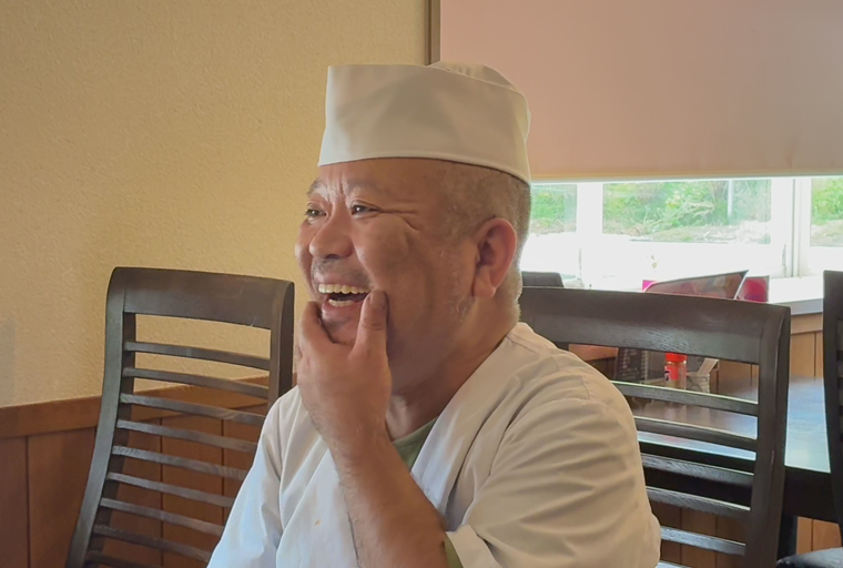 インタビューを受ける中村さん