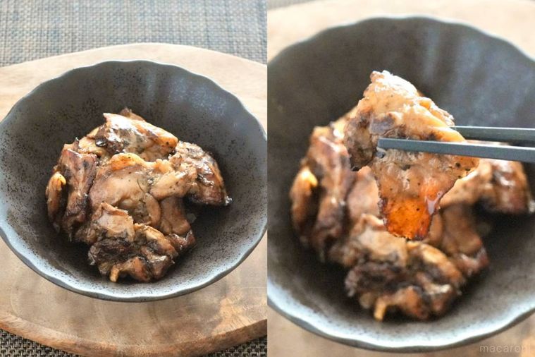 木のカッティングボードにのった黒い器に盛られたハラミの炭火焼きを黒い箸で持ち上げる様子